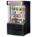 True TAC-14GS-LD 30-inch black open air refrigerator with lighted sign, stocked with drinks and snacks