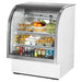 True TCGG-36-HC-LD 36-inch white curved glass refrigerated deli case with stainless trim, stocked with food