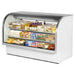 True TCGG-72-HC-LD 72-inch white curved glass refrigerated deli case stocked with drinks and sandwiches