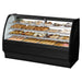 True TGM-DC-77-SC/SC-B-W 77-inch black curved glass dry display case filled with pastries, angled view