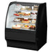 True TGM-R-36-SC/SC-B-W 36-inch black curved glass refrigerated pastry display case filled with cakes