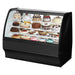 True TGM-R-59-SC/SC-B-W 59-inch black curved glass refrigerated pastry display case filled with cakes