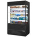 True TOAM-48 48-inch black open air refrigerated merchandiser with glass sides and no sign panel, stocked