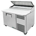 True TPP-AT-44-HC 44" single door stainless steel pizza prep table with white cutting board and lid raised