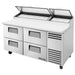 True TPP-AT-67-HC 67" pizza prep table in the four-drawer configuration, stainless steel with lids raised