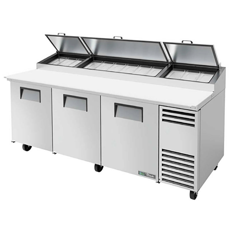 True TPP-AT2-93-HC 93" three door stainless steel pizza prep table with three lids raised and white cutting board