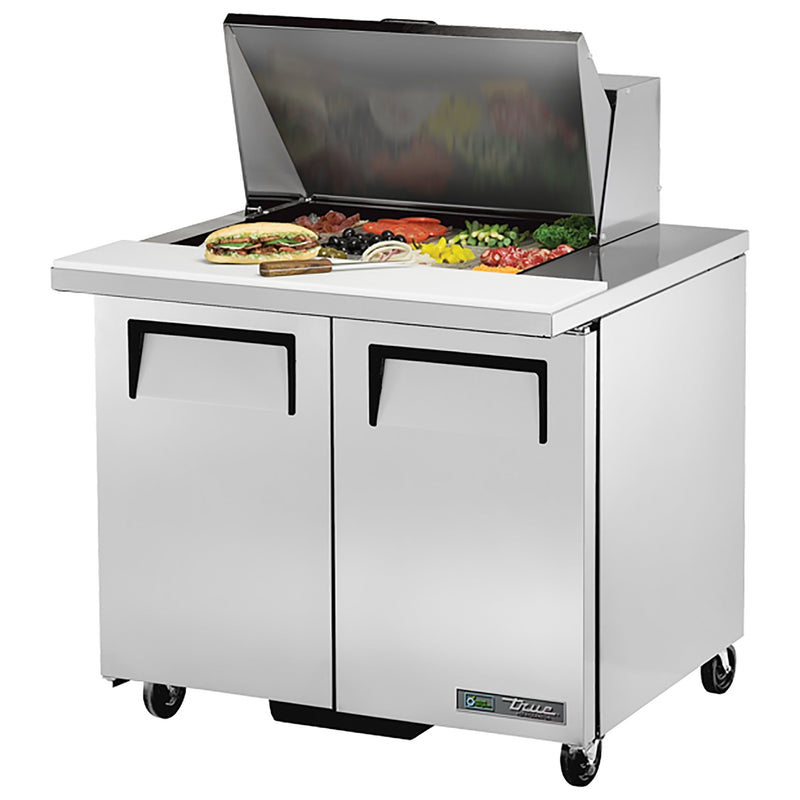 True TSSU-36-12M-B-HC 36" two door stainless steel mega top sandwich prep table with lid open over ingredients
