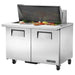 True TSSU-48-18M-B-HC 48" two door mega top sandwich prep table with lid open over toppings, front view
