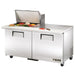True TSSU-60-24M-B-ST-HC 60" two door mega top sandwich prep table with lid open over ingredients, angled left