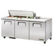 True TSSU-72-18-HC 72" three door stainless steel sandwich prep table with lid open over toppings, angled left view
