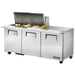 True TSSU-72-30M-B-ST-HC 72" three door mega top sandwich prep table with one stainless lid raised, front view