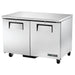 True TUC-48F-HC 48-inch double door stainless steel under counter freezer on casters, angled front view