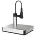 Unox XUC175 vacuum platform, stainless steel base with flexible black vacuum arm and nozzle, angled view