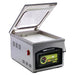 VacMaster VP210 chamber vacuum packaging machine with lid open showing the chamber and white filler plate