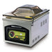VacMaster VP210 stainless steel countertop chamber vacuum sealing machine with tinted domed lid closed, angled view