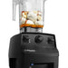 Vitamix 062824 commercial drink blender, close-up of the black base controls with ingredients blending in the container