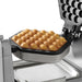 Waring WBW300X bubble waffle maker, close-up of a golden bubble waffle cooked in the nonstick plate