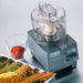 Waring WCG75 Pro Prep 3/4 quart chopper grinder on a counter beside bowls of ground spices and cinnamon