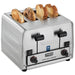 Waring WCT850RC heavy duty four slot pop-up toaster in stainless steel shown with toasted bread in the slots