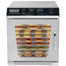 Waring WDH10 commercial 10 tray dehydrator, front view with fruit slices drying on trays behind the glass door