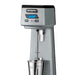 Waring WDM120TX single-spindle drink mixer, stainless steel cup lowered beneath the spindle, front view
