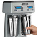 Waring WDM240TX double spindle drink mixer, hand placing a stainless steel cup under the second spindle