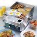 Waring WGR140X 14-inch electric griddle shown in use cooking pancakes, eggs and hash browns