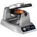 Waring WICSP180 gelato panini press with a sealed brioche bun on the plate, lid partly open, angled view