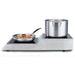 Waring WIH800 double induction burner, side view with a stockpot on the raised rear hob and a sauté pan in front