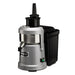Waring WJX80X heavy duty juice extractor, angled side view showing the black pulp container and spout
