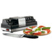 Waring WKS800 electric knife sharpener shown with a chef's knife and a plate of caprese salad