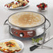 Waring WSC160X 16-inch electric crepe maker shown cooking a crepe beside plates of filled crepes and fruit