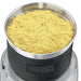 Waring WSG60 3 cup wet and dry spice grinder, close-up of the stainless steel bowl filled with ground spice