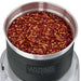 Waring WSG60 3 cup wet and dry spice grinder, close-up of the stainless steel bowl filled with chili flakes