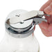 Winco glass syrup dispenser, close-up of a thumb pressing the chrome plated lever to open the pour spout