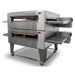 XLT 3255 Series compact conveyor ovens shown double-stacked on a stainless steel caster stand, angled front view