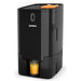 Zummo VIVA electric citrus juicer in black with oranges in the top feeder and a glass of juice under the spout