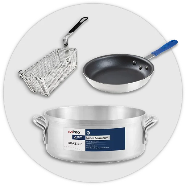 Commercial cookware including stock pots, saucepans, fry pans, and cast iron skillets.