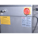 Alpha AVS-30 30 qt commercial spiral mixer, close-up of the red and yellow main power switch and rating plate
