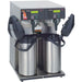 Bunn AXIOM-TWIN-APS stainless steel twin airpot coffee brewer with hot water tap and two airpots, angled view