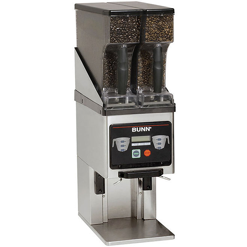 Bunn MHG-SS stainless steel funnel coffee grinder with two bean hoppers, LCD screen and batch buttons, angled view