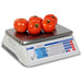 Detecto D Series price computing scale weighing tomatoes, alternate angle showing the keypad and blue LCD screens