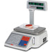 Detecto DL Series price computing scale with pole display and built-in label printer, shown weighing a deli item