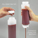 FIFO squeeze bottles shown filled with sauce, demonstrating fill from the top and dispense from the bottom valve