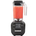 Hamilton Beach HBB255 Rio commercial drink blender in black with 48 oz clear jar of red smoothie, front view