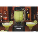 Hamilton Beach HBB908R 44 oz commercial bar blender with a frozen margarita, shown beside two garnished glasses
