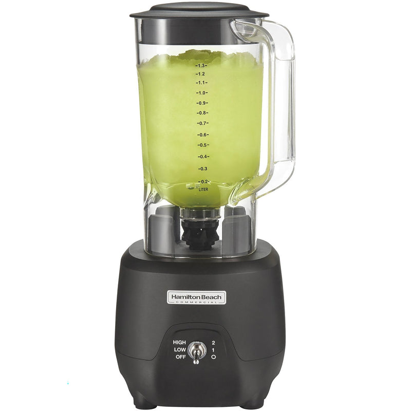 Hamilton Beach HBB908R 44 oz commercial bar blender with clear container of green drink and black base, front