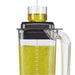 Hamilton Beach HBF510 Expeditor blender/food processor, oil drizzling through the clear lid cap into the jar