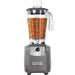 Hamilton Beach HBF600R Expeditor 64 oz culinary blender with clear container of blended vegetables, front