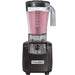 Hamilton Beach HBH650R The Tempest 64 oz commercial blender with clear container of pink smoothie, front view